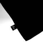 A luxury Imported Saudi niqab laid flat, displaying its elegant shape, color, and fine stitching. Modify.pk