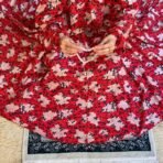 A woman using a Winter Namaz Chadar, performing namaz. Modify.pk