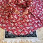 A woman using a Winter Namaz Chadar, performing namaz. Modify.pk