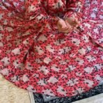 A woman using a Winter Namaz Chadar, performing namaz. Modify.pk