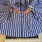 A woman using a Winter Namaz Chadar, performing namaz. Modify.pk