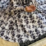 A woman using a Winter Namaz Chadar, performing namaz. Modify.pk