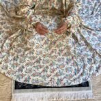 A woman using a Winter Namaz Chadar, performing namaz. Modify.pk