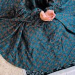 A woman using a Winter Namaz Chadar, performing namaz. Modify.pk